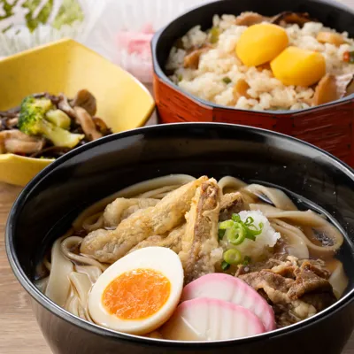 Kishimen Noodles Topped With Beef Sukiyaki And Egg And Seasonal Rice Dish